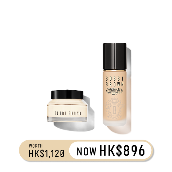 Close up of model applying Crushed-Oil Infused Gloss to lips